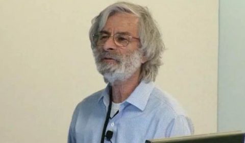 Leslie Lamport wearing a suit and tie