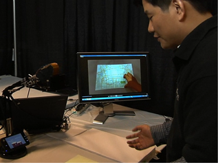 a man sitting at a desk in front of a computer