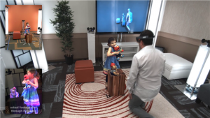 Holoportation - a man wearing a Hololens device standing in front of a 'hologram' girl