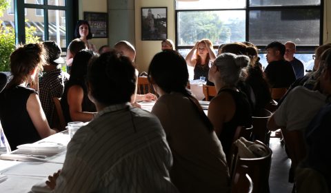 a group of people sitting at a table