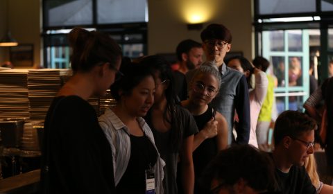 a group of people standing in a room