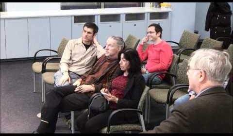 a group of people sitting in chairs