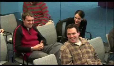 a group of people sitting at a table