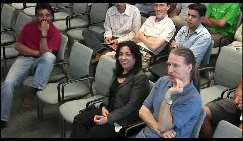 a group of people sitting posing for the camera