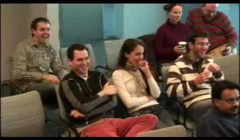 a group of people sitting posing for the camera