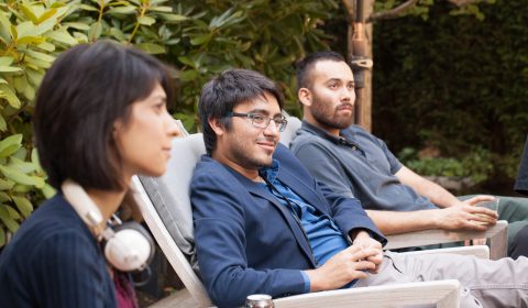 a group of people sitting on a bench