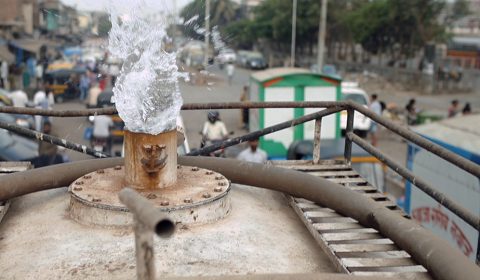 photo of water gushing out of a pipe