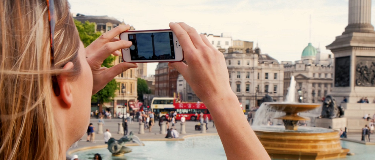 Woman using a smartphone app in London