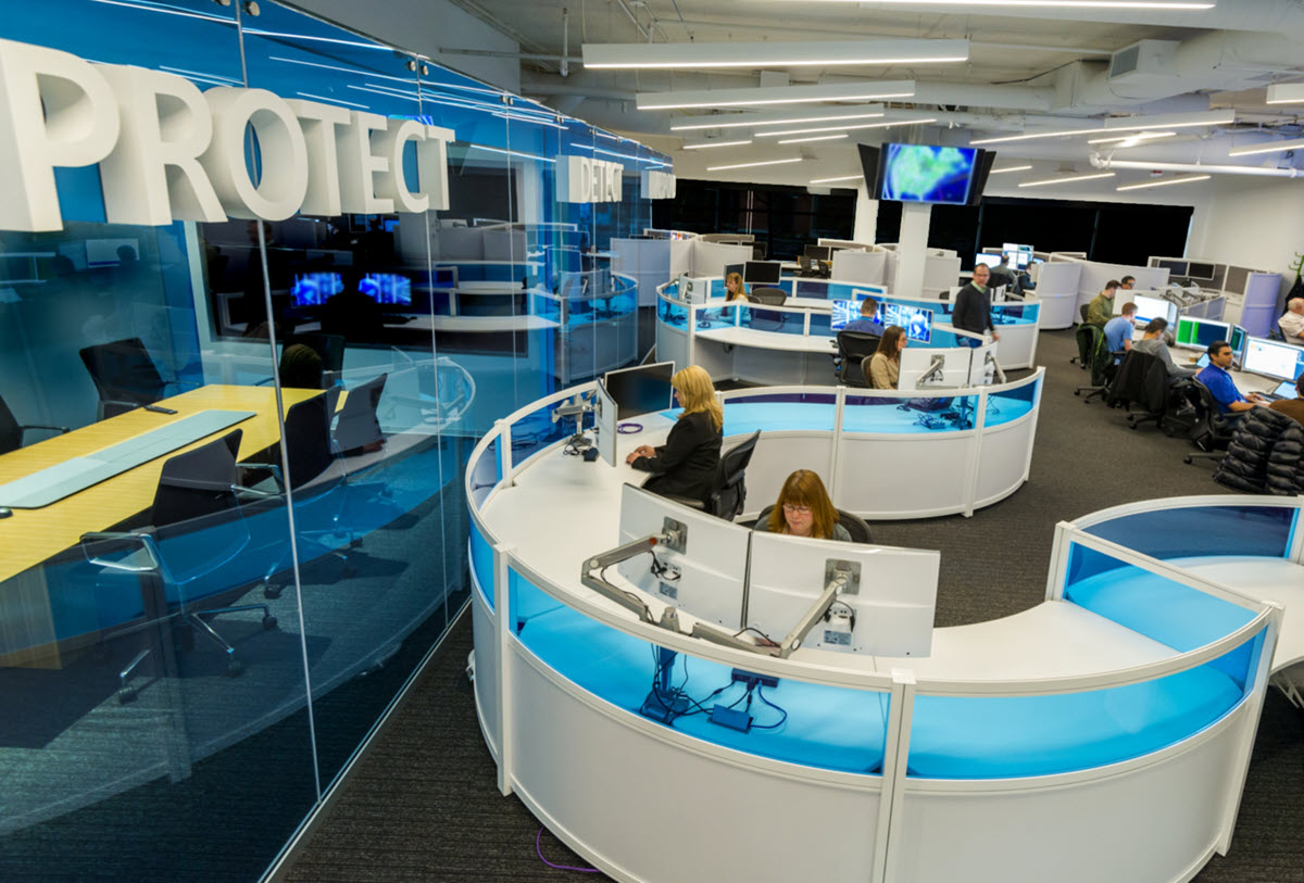 Photo of Microsoft Cyber Defense Operations Center with the word "Protect" in the foreground.