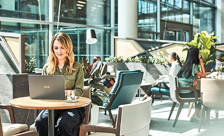 Image of a woman working at her office.