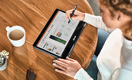 Image of a woman using a pen on a tablet.