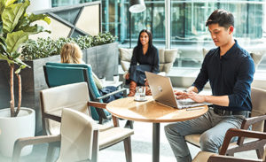 Image of a small worker gathering in a conference room.