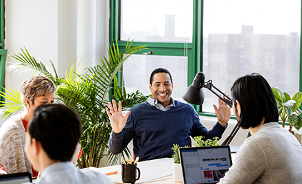 Image of a small business team collaborating in modern workplace.