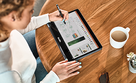 Image of a woman using a pen on a tablet.