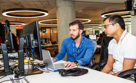 Two people looking at a computer screen