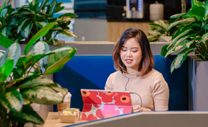 Image of a woman working on mobile device.