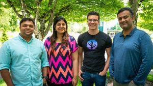 Nirag Tibdewal, Loviee Makkar, Stephen Smith, Software engineers in Microsoft Digital and Ullas Kumble, lead software engineer in Microsoft Digital, smile for a photo outside.