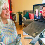 Corine Kuchling talks to Johan Bosch and Daniel Manalo from her home office while Bosch and Manalo are shown on her computer screen.