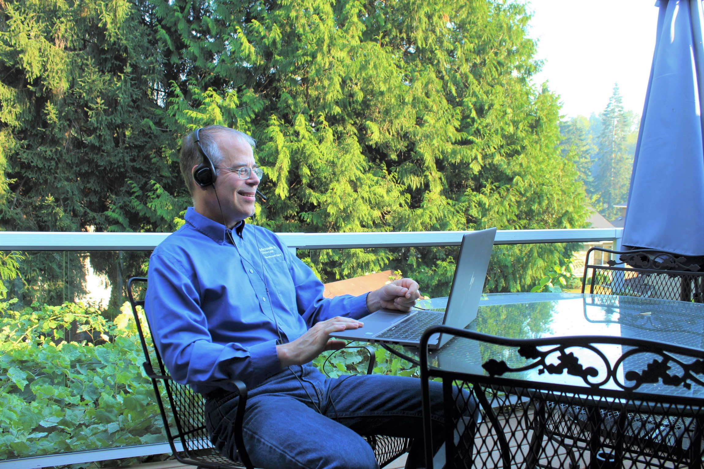 Dodd Willingham sits on his porch with his laptop, checking in with his search administration team.