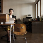 Business woman in office with Surface