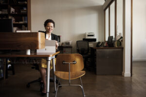 Business woman in office with Surface