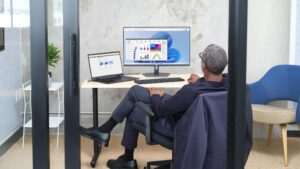 An employee works at his computer in an office in a Microsoft building.