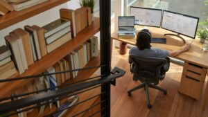 A Microsoft employee works at their desk in their home office.