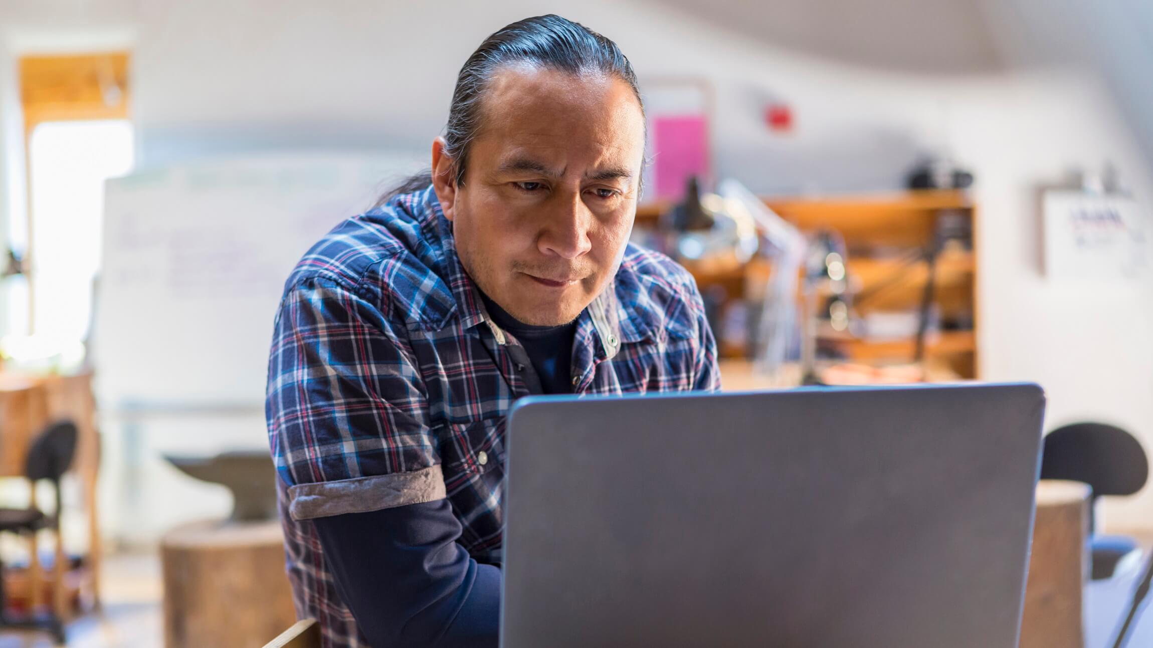 A man uses search at his PC.