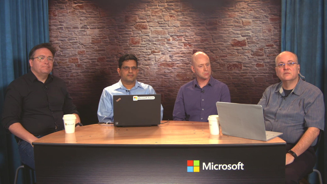 Left to right: Kellie Larkin, Raghavendran Venkatraman, David Lef and Pete Apple sit at a table at the Inside track video studio.