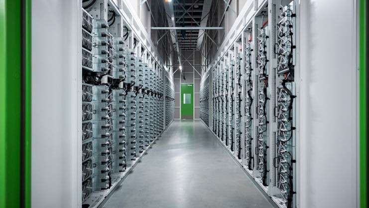 A view looking down an aisle of server banks.