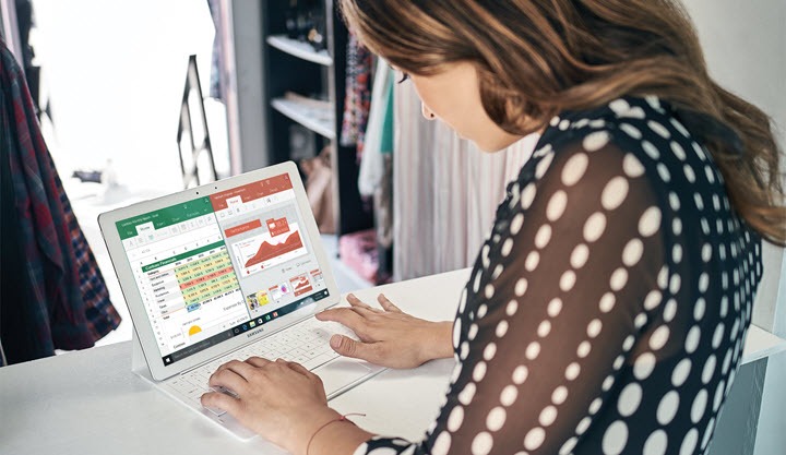 Woman looks at computer screen