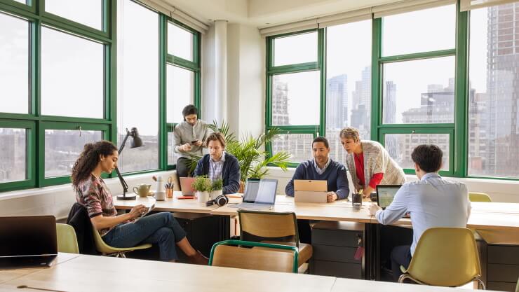 A group of coworkers collaborating in an office.