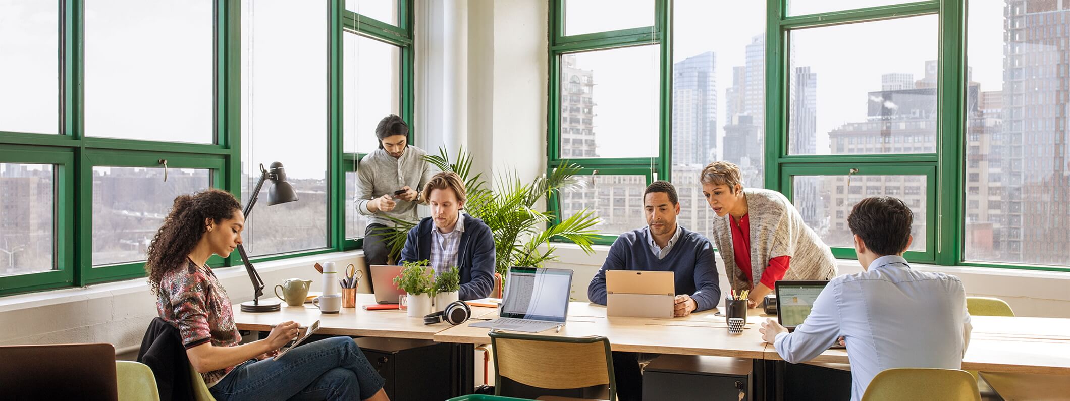 A group of coworkers collaborating in an office.