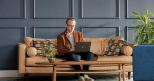 Image of a man working on a couch.