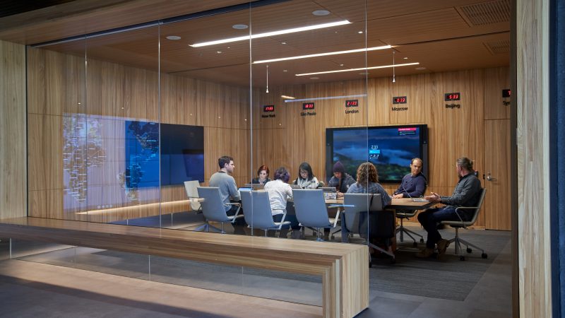 colleagues sitting at meeting room table
